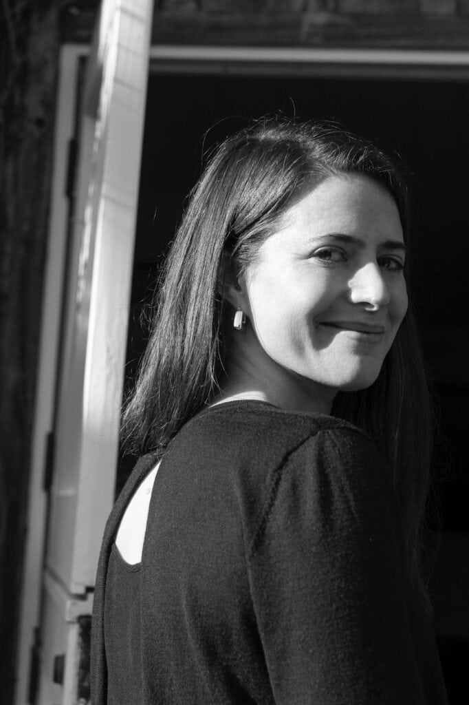 Elegant singer enjoying wine at Baker Lane Tasting Group.